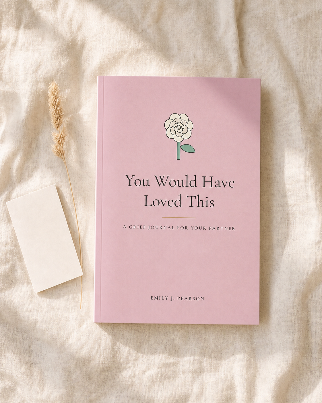 You Would Have Loved This, A Grief Journal for Your Partner, on soft linen beside a blank notecard